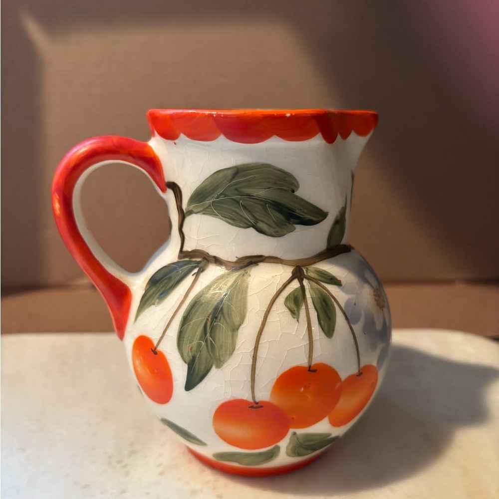 Hand-Painted Ceramic Pitcher with Red and Green Design